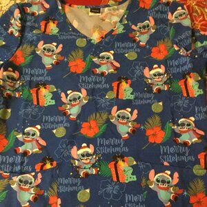 Excellent condition Disney Stitch Christmas scrub top size medium has pockets